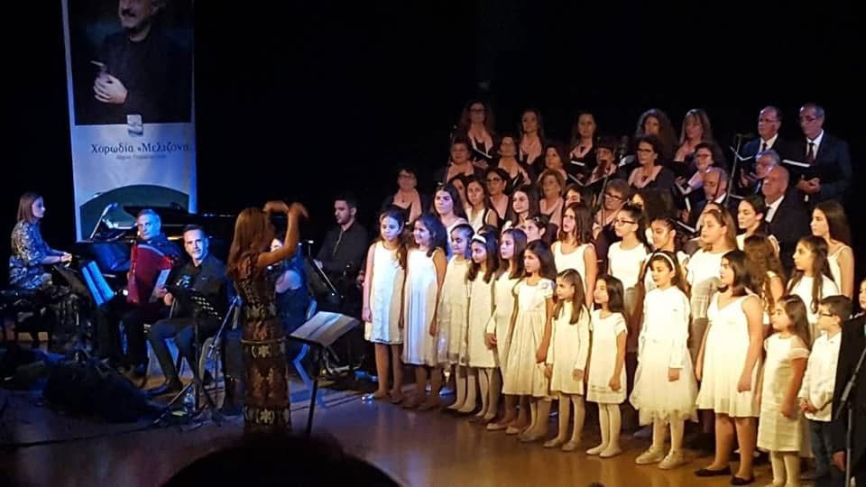 Choir performing with piano and accordion accompaniment