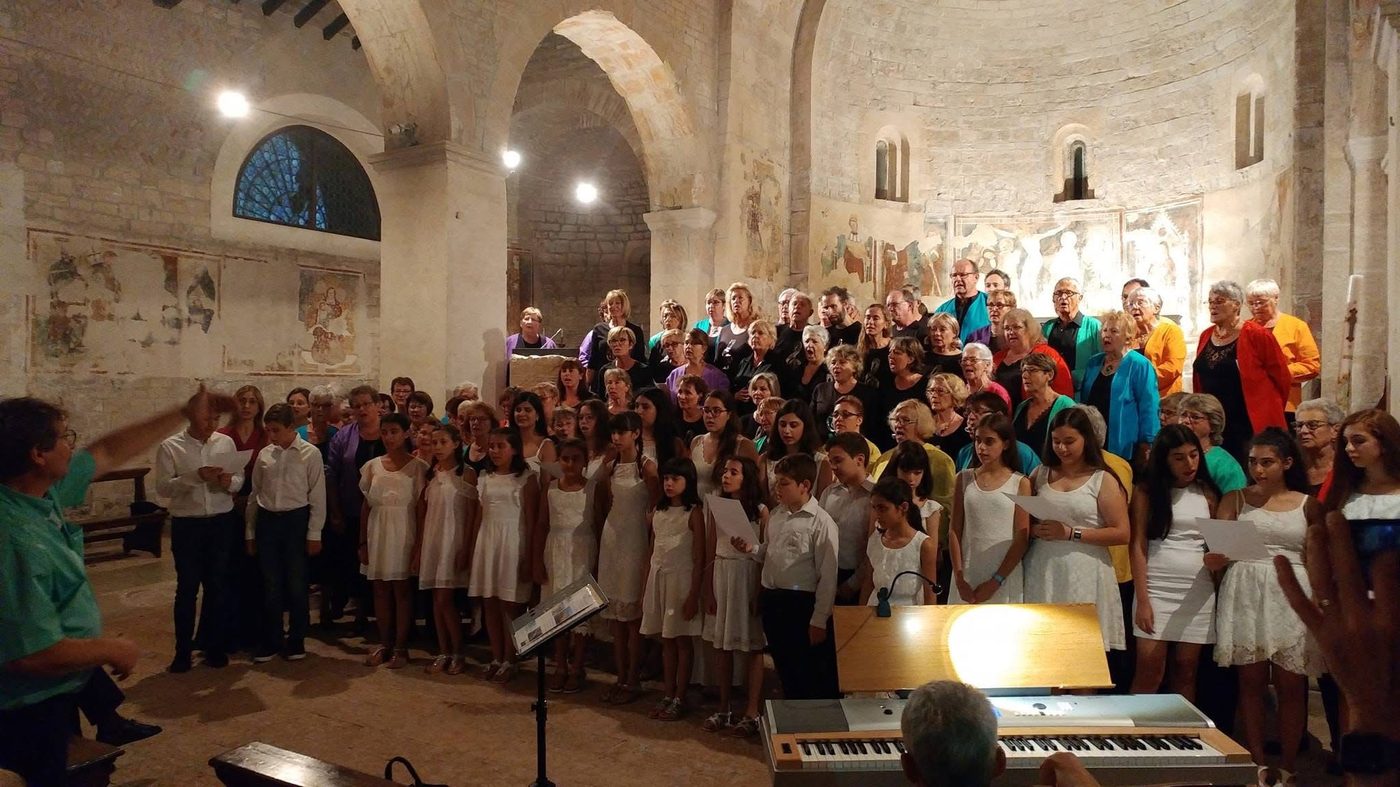Choir performing inside a centuries-old frescoed church